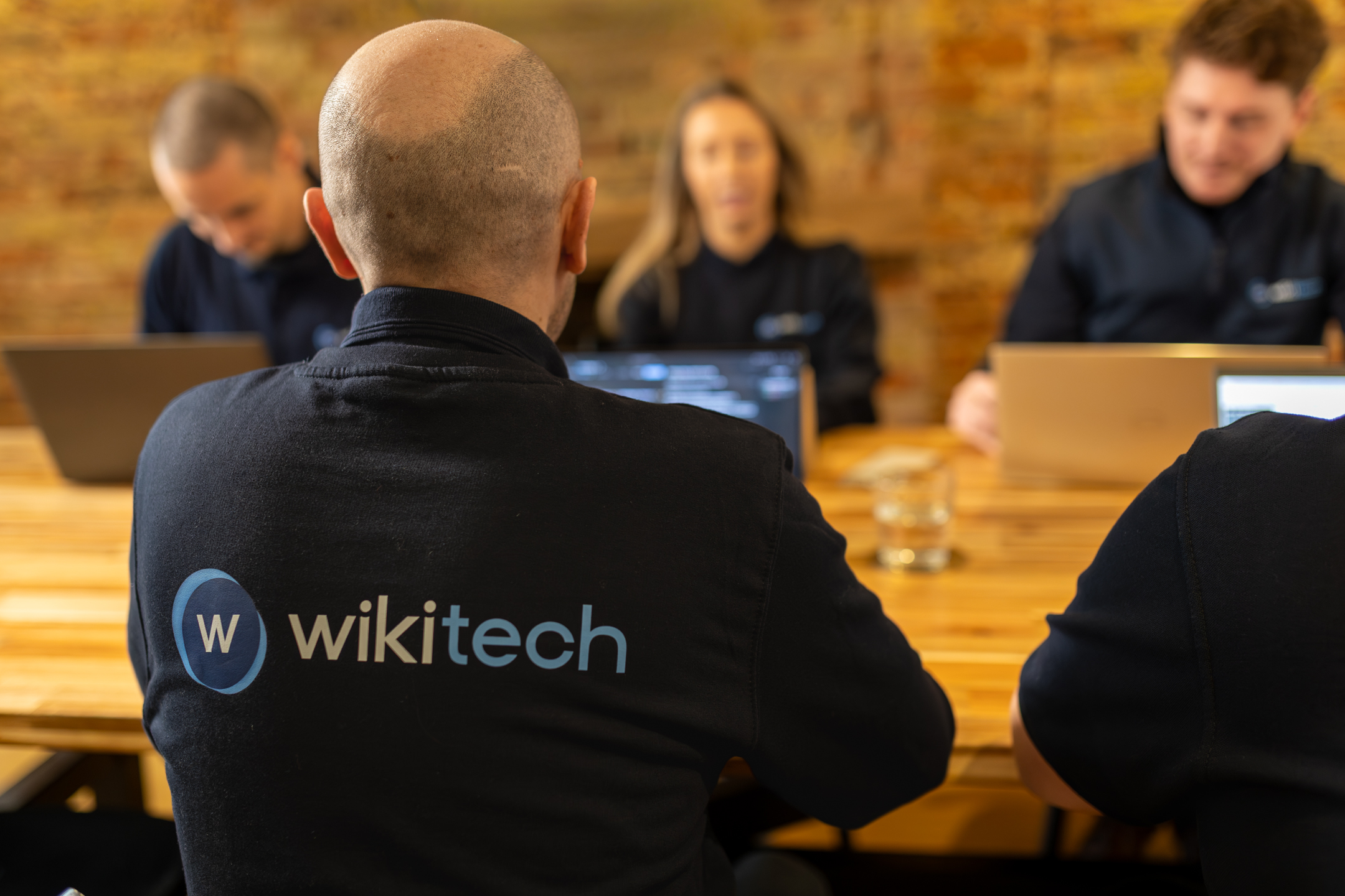 WikiTech team in a meeting at the Maidstone office